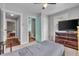Inviting bedroom with multiple doors, neutral palette, and ample natural light at 1124 S Lockburn St, Indianapolis, IN 46241