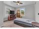 Bright bedroom with dual windows, wooden furniture, and plush carpet providing comfort at 1124 S Lockburn St, Indianapolis, IN 46241