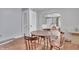 Cozy dining area with hardwood floors, a charming table set, and bright, airy feel at 1124 S Lockburn St, Indianapolis, IN 46241
