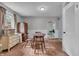 Bright dining room with hardwood floors, a classic table set, and ample natural light at 1124 S Lockburn St, Indianapolis, IN 46241