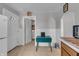 Bright kitchen with white door, vintage table, and an inviting view into the laundry area at 1124 S Lockburn St, Indianapolis, IN 46241