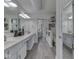Bright bathroom with double sinks and vanity area, plus a walk-in shower at 1130 Deerbrook Trl, Greenwood, IN 46142