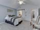 Comfortable bedroom with barn door leading to bathroom and sitting area at 1130 Deerbrook Trl, Greenwood, IN 46142
