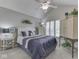 Bedroom featuring a vaulted ceiling, plantation shutters, and coordinated decor at 1130 Deerbrook Trl, Greenwood, IN 46142
