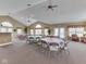 Large community room with vaulted ceilings, ceiling fans, and ample seating for social gatherings at 1130 Deerbrook Trl, Greenwood, IN 46142