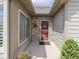Covered entryway with stone detailing and a view of the front door at 1130 Deerbrook Trl, Greenwood, IN 46142