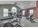 Bright exercise room featuring modern equipment, including treadmills and elliptical machines at 1130 Deerbrook Trl, Greenwood, IN 46142