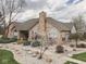 Attractive stone house with a manicured lawn, tasteful landscaping, and an inviting entrance at 1130 Deerbrook Trl, Greenwood, IN 46142