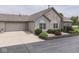Charming single-story home featuring a stone facade, two-car garage and beautifully landscaped front yard at 1130 Deerbrook Trl, Greenwood, IN 46142