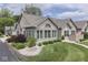 Charming home featuring a stone facade, manicured lawn, and well-kept landscaping at 1130 Deerbrook Trl, Greenwood, IN 46142