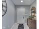 Welcoming foyer with a decorative mirror, chest, and tiled flooring at 1130 Deerbrook Trl, Greenwood, IN 46142