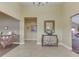 Inviting foyer boasts tiled floors, a decorative chest, and a view to additional living spaces at 1130 Deerbrook Trl, Greenwood, IN 46142