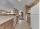 Well-lit kitchen features updated appliances, tile floors, and open access to a large living space at 1130 Deerbrook Trl, Greenwood, IN 46142