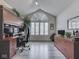 Organized office with built-in desk, large window with shutters, and ample storage space for a productive work environment at 1130 Deerbrook Trl, Greenwood, IN 46142