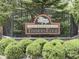 Entrance to 'The Reserve at Timbers Edge' framed by lush greenery and stone accents at 1130 Deerbrook Trl, Greenwood, IN 46142