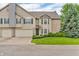 Inviting home featuring an attached garage, neutral siding, green lawn, and tasteful landscaping at 1139 Fernwood Way, Plainfield, IN 46168