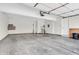 Clean, empty two-car garage interior with white walls, concrete floors, and storage space at 1139 Fernwood Way, Plainfield, IN 46168