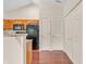Kitchen features oak cabinets, granite countertops, and hardwood floors at 1139 Fernwood Way, Plainfield, IN 46168