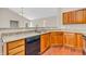 An updated kitchen featuring granite counters, wood cabinets, modern appliances and an open layout at 1139 Fernwood Way, Plainfield, IN 46168