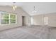 Bright living area with neutral walls and large window; view to the patio at 1139 Fernwood Way, Plainfield, IN 46168