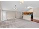 Open-concept living room with vaulted ceiling and view into the kitchen at 1139 Fernwood Way, Plainfield, IN 46168