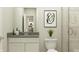 Modern bathroom with sleek vanity, framed mirror, and glass-enclosed shower at 11626 Aubrey Ln, Fishers, IN 46040