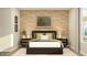 Inviting bedroom featuring stylish decor, wood-look wall, and comfortable furnishings at 11626 Aubrey Ln, Fishers, IN 46040