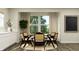 Bright dining room featuring a round table with caned chairs and modern decor accents at 11626 Aubrey Ln, Fishers, IN 46040