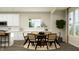 Cozy dining room with stylish table and chairs, bathed in natural light from the adjacent window at 11626 Aubrey Ln, Fishers, IN 46040