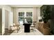 Bright home office with stylish black desk, decor, and comfortable seating at 11626 Aubrey Ln, Fishers, IN 46040