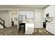 Modern kitchen featuring white cabinets, stainless steel appliances, and a center island at 11626 Aubrey Ln, Fishers, IN 46040