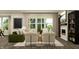 Cozy living room featuring a fireplace, plush seating, and bright natural lighting at 11626 Aubrey Ln, Fishers, IN 46040