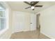 Bedroom with closet, window, neutral paint, ceiling fan and neutral carpet at 125 S Alfonte St, Ingalls, IN 46048