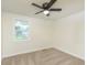 Cozy bedroom with neutral carpet, ceiling fan, window and neutral paint at 125 S Alfonte St, Ingalls, IN 46048