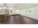 Bright living space with hardwood floors connects the kitchen and living areas, providing an open feel at 125 S Alfonte St, Ingalls, IN 46048