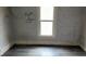 Empty bedroom with graffiti on the walls at 127 S Belmont Ave, Indianapolis, IN 46222
