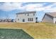 Large backyard offering ample space for outdoor activities and potential landscaping at 1381 Avocet Dr, Greenwood, IN 46143