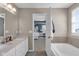 This bathroom features a double sink vanity and a soaking tub for a serene bathing experience at 1381 Avocet Dr, Greenwood, IN 46143