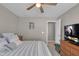 Comfortable bedroom has soft lighting, neutral walls, and a ceiling fan for added comfort at 1381 Avocet Dr, Greenwood, IN 46143