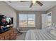 Cozy bedroom features a ceiling fan, window with blinds, and calming neutral decor at 1381 Avocet Dr, Greenwood, IN 46143