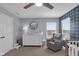 Cozy Bedroom featuring a rocking chair, dresser with changing station, and playful wall decor at 1381 Avocet Dr, Greenwood, IN 46143