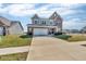 Inviting home with a long driveway and neatly landscaped front yard at 1381 Avocet Dr, Greenwood, IN 46143