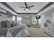 This main bedroom boasts recessed ceiling details, a ceiling fan, and plentiful natural light at 1381 Avocet Dr, Greenwood, IN 46143