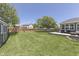 This property features a vast backyard, complete with a wooden deck and play set at 1480 E Jefferson St, Franklin, IN 46131