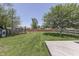 The backyard features a playset, lawn, and wooden deck, perfect for outdoor activities at 1480 E Jefferson St, Franklin, IN 46131