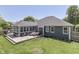 Spacious backyard featuring a large deck with seating and a view of the home's rear exterior at 1480 E Jefferson St, Franklin, IN 46131