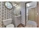 Quaint bathroom with floral wallpaper, an octagon window, and a charming vintage feel at 1480 E Jefferson St, Franklin, IN 46131