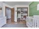 The Bedroom closet features ample storage space with custom shelving and hanging racks at 1480 E Jefferson St, Franklin, IN 46131