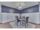 This is a formal dining room with wainscotting, a round table, and seating for four at 1480 E Jefferson St, Franklin, IN 46131