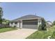 Well-maintained single-Gathering home showcasing a gray brick and a two-car attached garage at 1480 E Jefferson St, Franklin, IN 46131